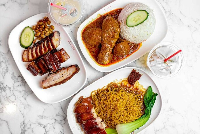 Selection of Hong Kong-style dishes of roast meat, rice and noodles.