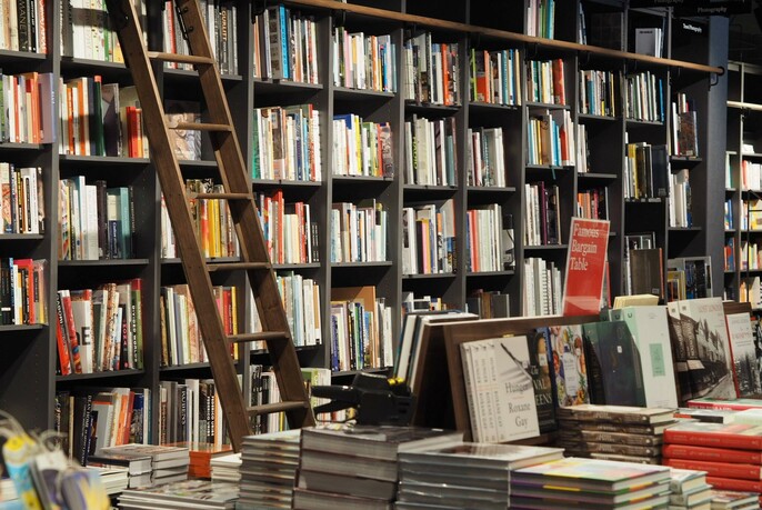 Books on shelves of bookshop.