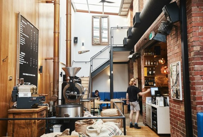 A coffee roastery with a staff member at work.
