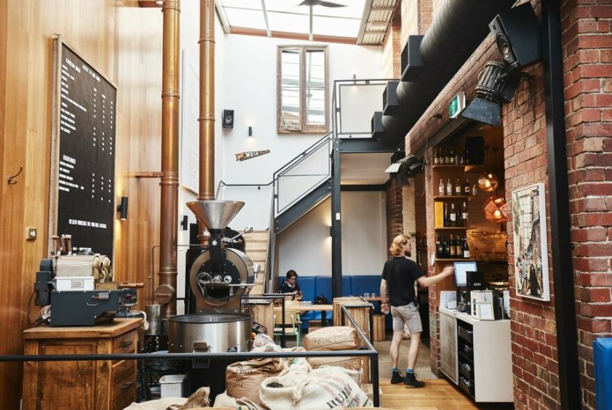 A coffee roastery with a staff member at work.