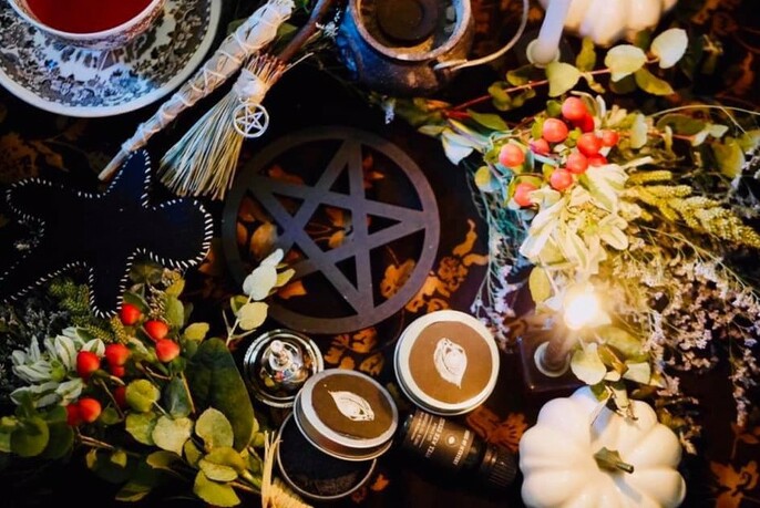 Close up of herbs, candles and other pagan and Wiccan products.