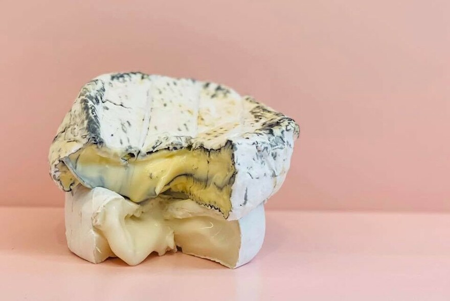 Two runny cheeses, one blue, one white.