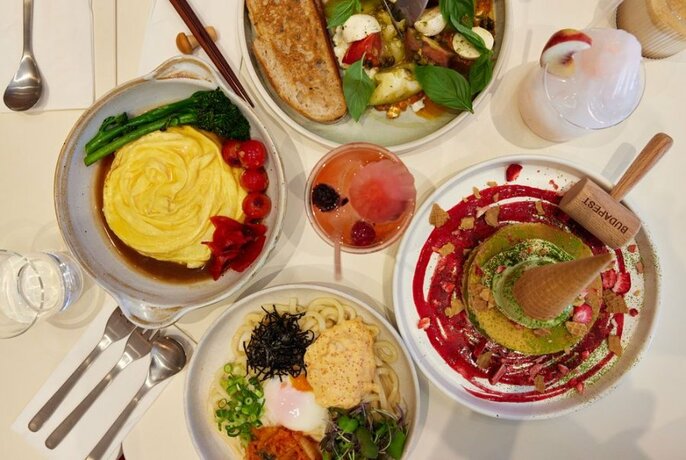Various plates of restaurant food, viewed from above.