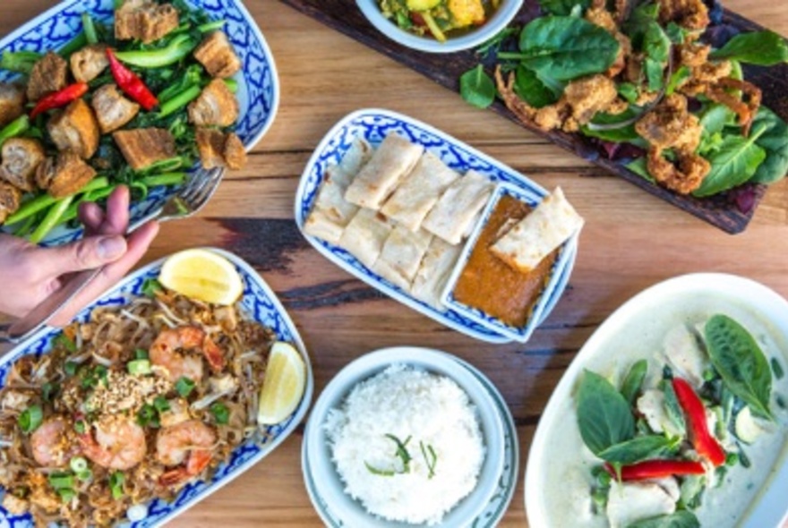 An array of Thai dishes on a table