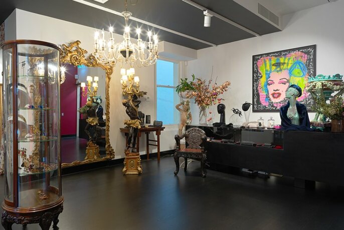 Fashion, fragrances, accessories, art and antiques in Christine on Collins store. 