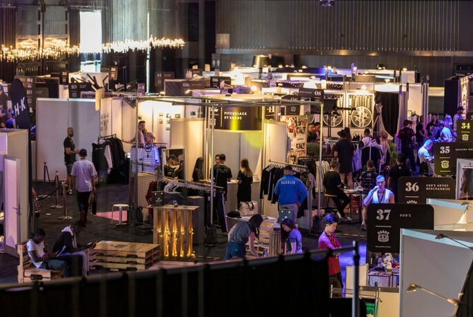 Expo stalls lit with purple lights.