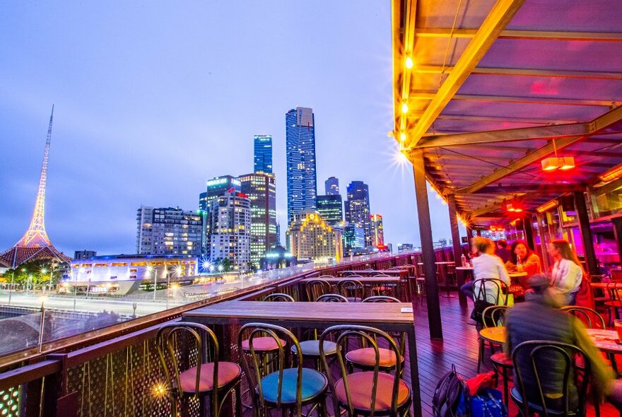 A rooftop bar overlooking the city skyline and Arts Centre.