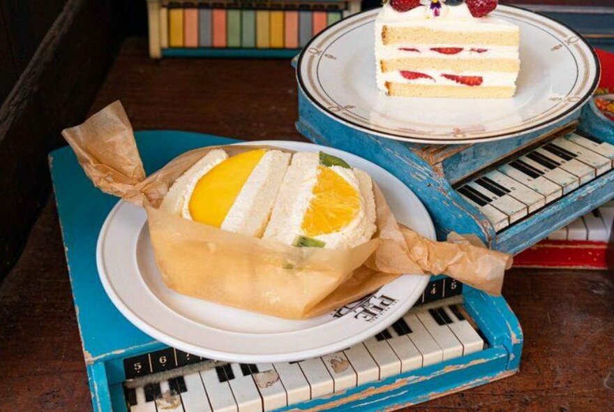 A white bread sandwich filled with cream and fruit in it
