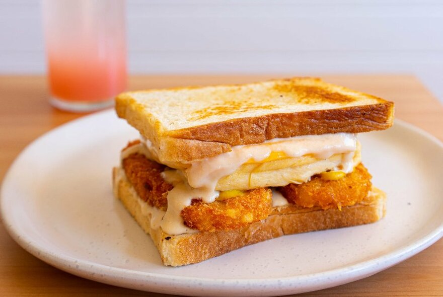 Toasted sandwich with fried filling.