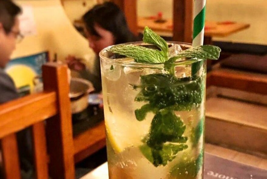 Iced drink with mint leaves inside Yamato restaurant.
