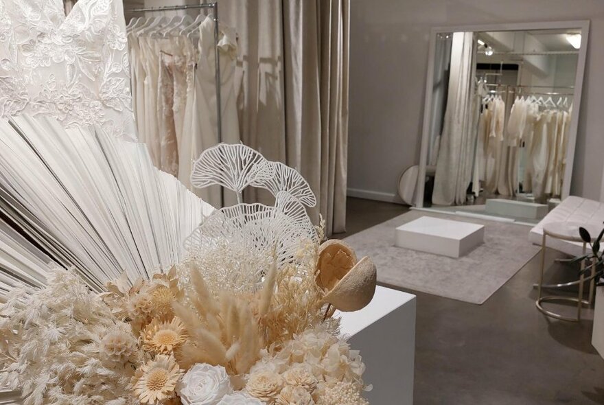 A changing room in a bridal shop with luxurious fittings and decorations. 