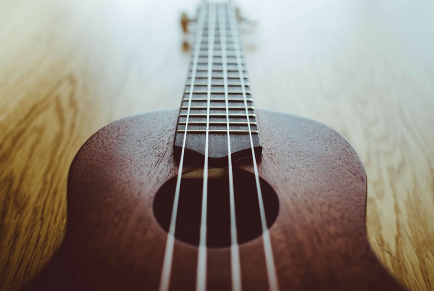 Close-up crop of a ukulele.