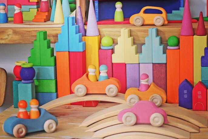 Street scene made of small, colourful wooden blocks.