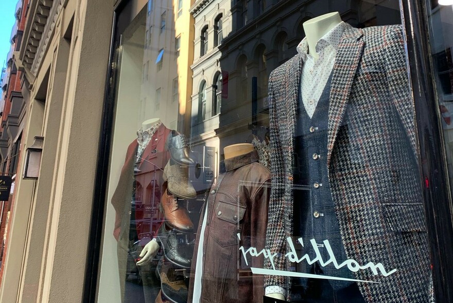 Men's clothing in window of Jay Dillon fashion menswear store.