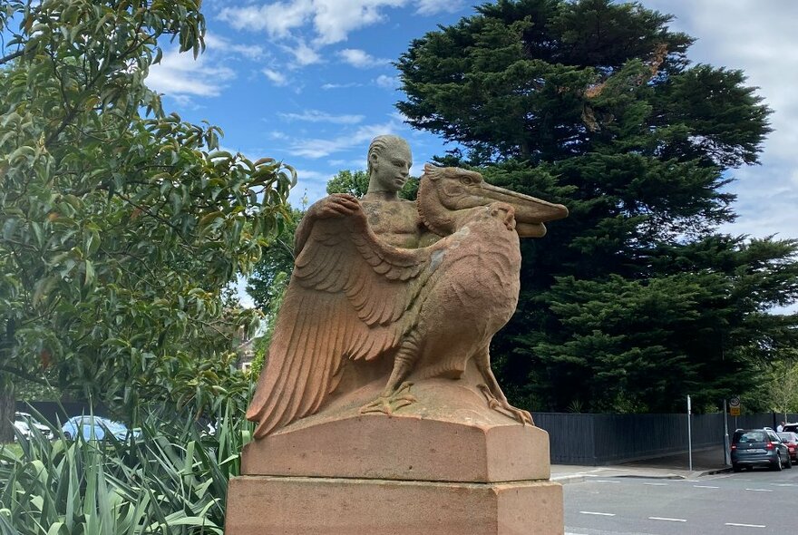 The boy and the pelican sandstone statue at Fitzroy Gardens. 