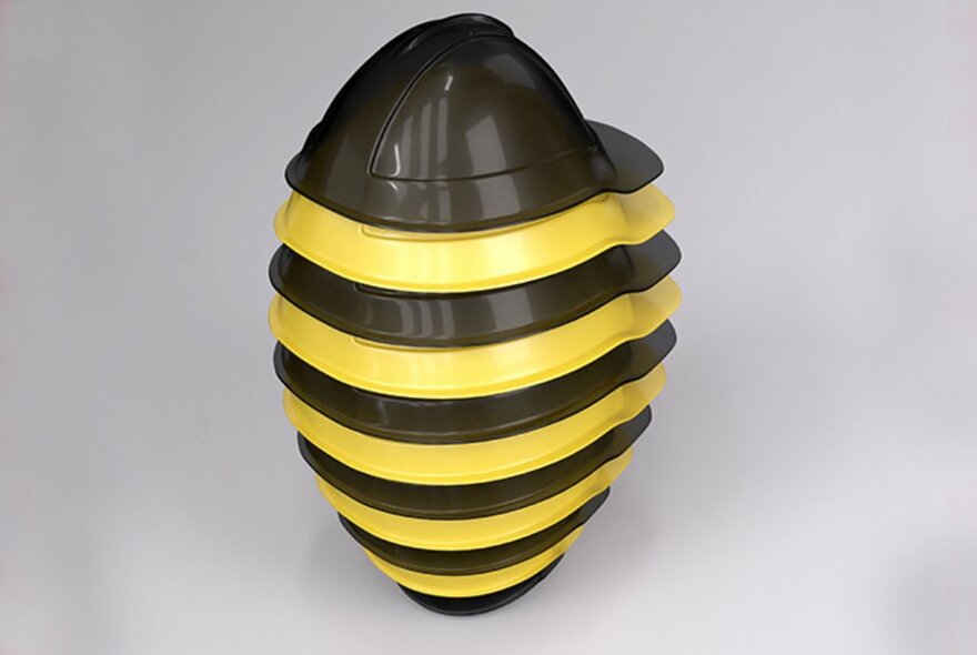 Sculpture comprised of stacked yellow and black plastic bowls.