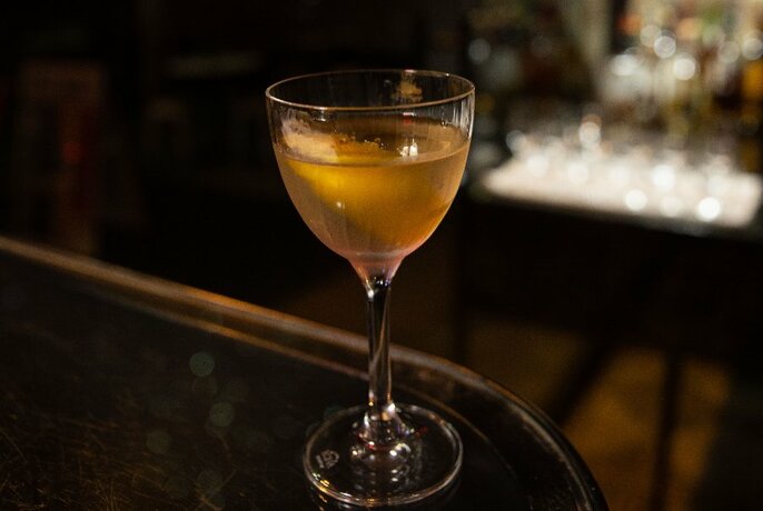 A martini in a dark bar.