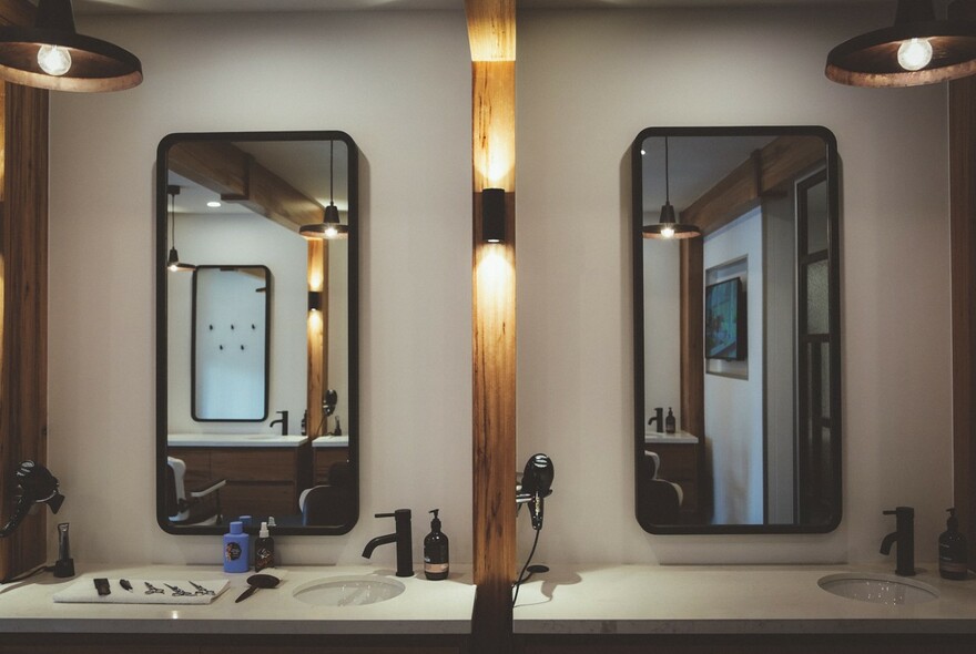 Interior of Alpha Barbers showing mirrors. 