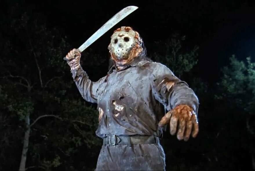 A person wearing torn and bloodied clothes, with disfigured hands, and a ghoulish face, brandishing a large machete, night scene in a forest. 