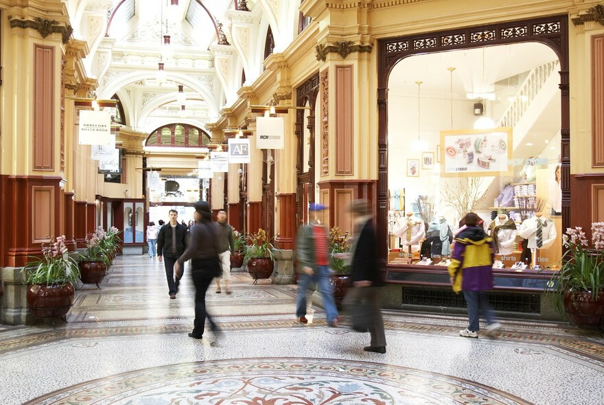 A lavish 19th century shopping arcade featuring an impressive mosaic floor.