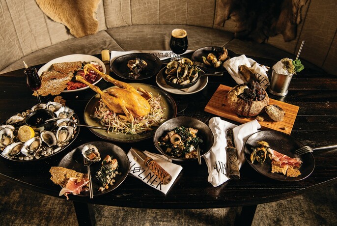 A table covered with a feast of dishes from Mjølner Melbourne.