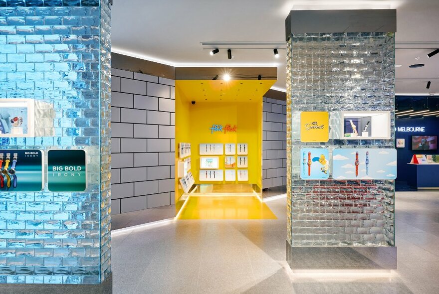 Store interior with shimmering brick columns and display shelves.