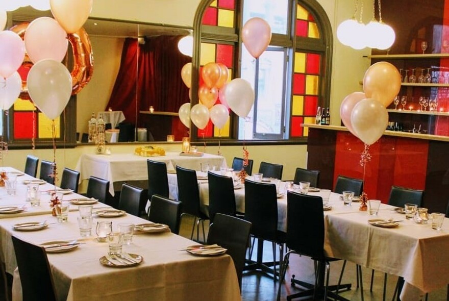 Restaurant decorated with balloons.