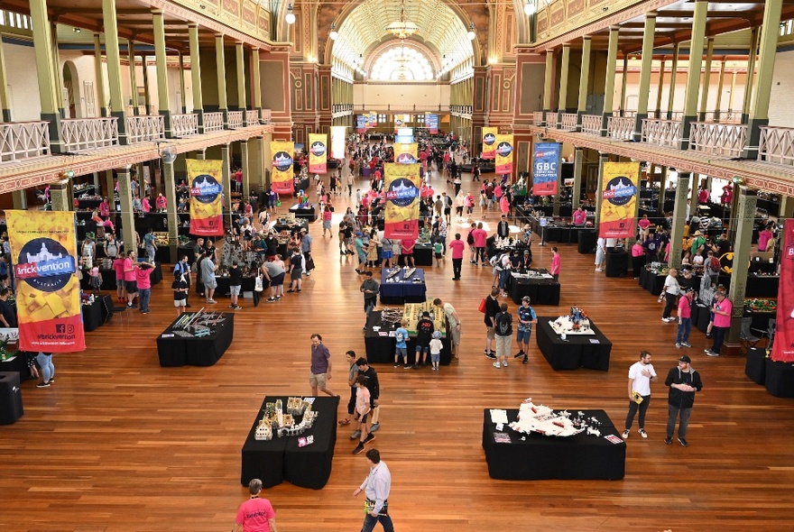 Royal Exhibition Building set up for an expo with banners and stalls.