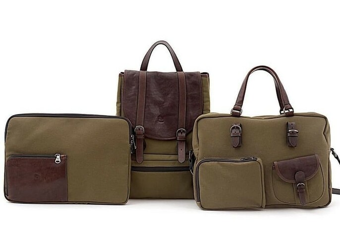 Khaki and brown leather travel bags and backpack.