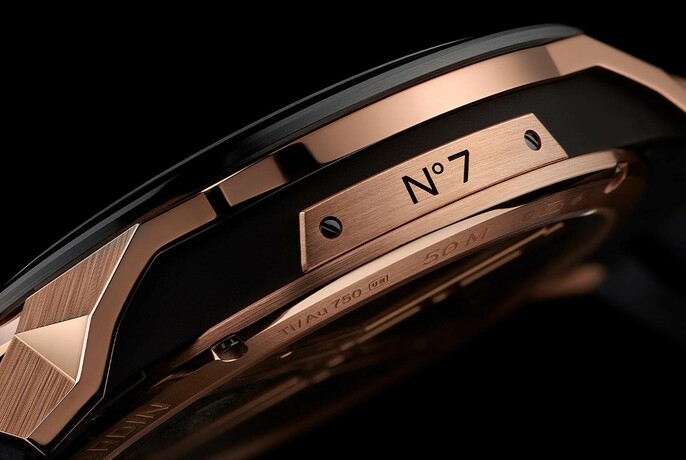 Detail of bronze-metal No 7 watch viewed from the side.