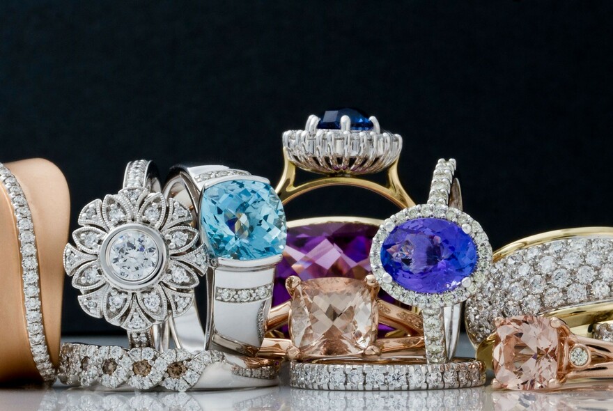 Treasure trove display of gems including diamond and precious stone bracelets.