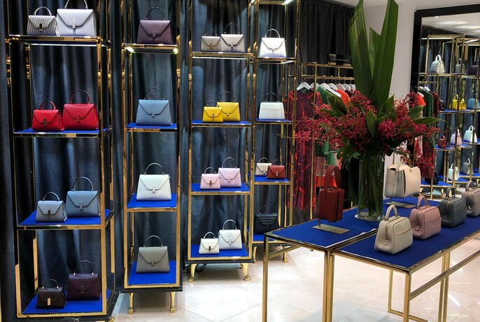 Brightly-coloured handbags on display at Harrolds designer fashion shop.