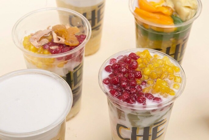 Various desserts in plastic Che cups.