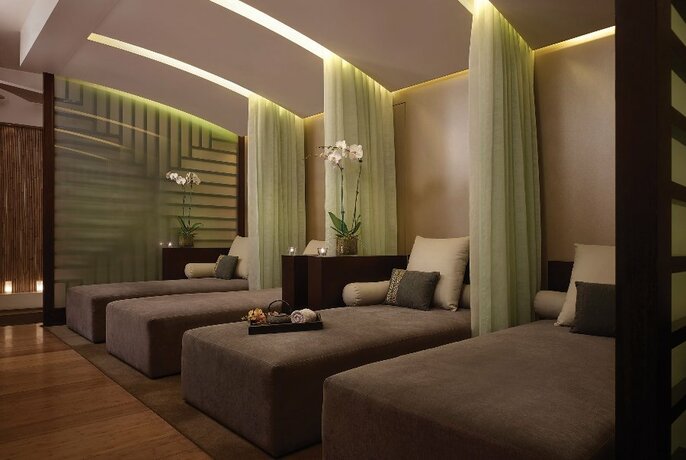 Luxurious spa beds with privacy curtains.