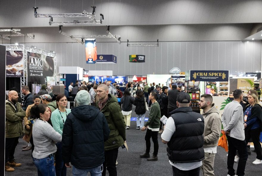 People milling around stalls at the Melbourne International Coffee Expo at the Melbourne Convention and Exhibition Centre.
