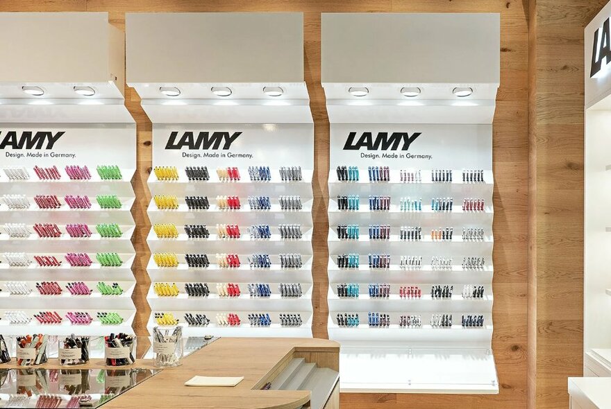 LAMY stationery displays with signage and rows of coloured pens.