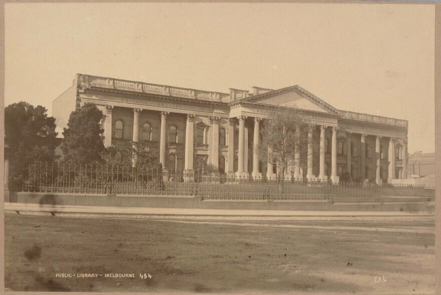The Public Library Melbourne, later State Library Victoria; vintage sepia image dating from 1880, of a large building with a facade of columns.