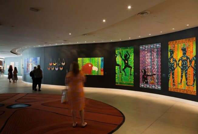 Woman looking at artwork in the Bunjilaka Aboriginal Cultural Centre at the Melbourne Museum. 