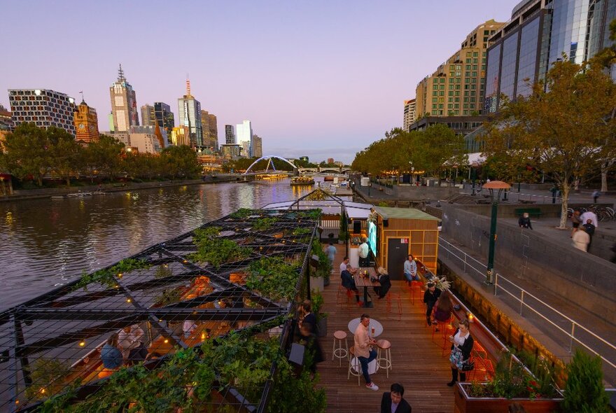 A riverside bar with a rooftop