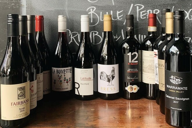 Collection of red wine bottles.