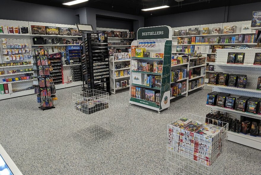 The interior of a store with games and toys on the shelves