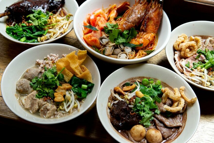Many dishes of Asian food on a table.