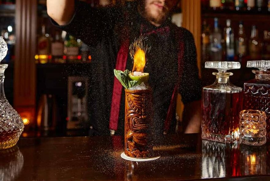 Tiki cocktail with a flaming top