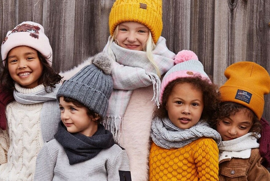 Kids in beanies, jumpers and scarves.