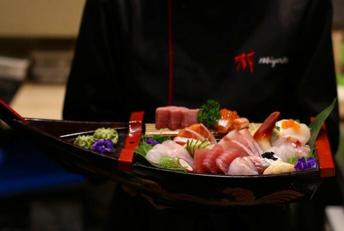 A selection of sashimi carried by a waiter at Miyako Japanese Cuisine and Teppanyaki.