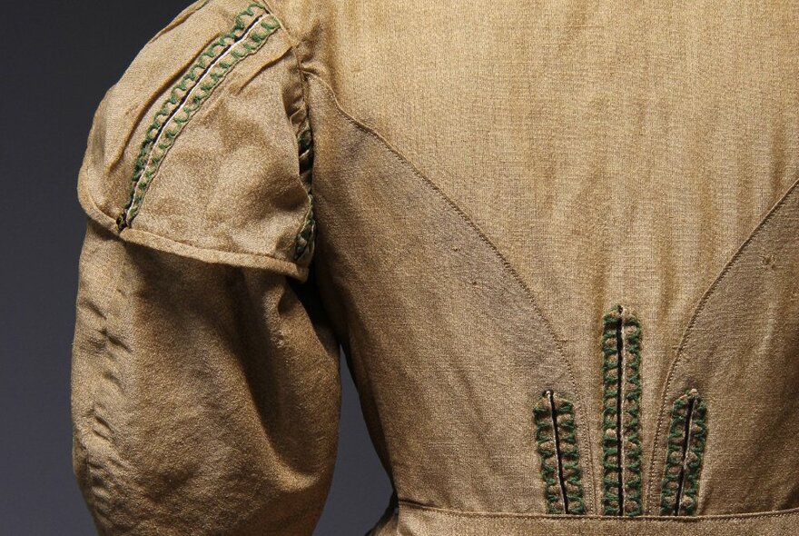 Detailed view of the back of an old fashioned dress dating from 1860s.