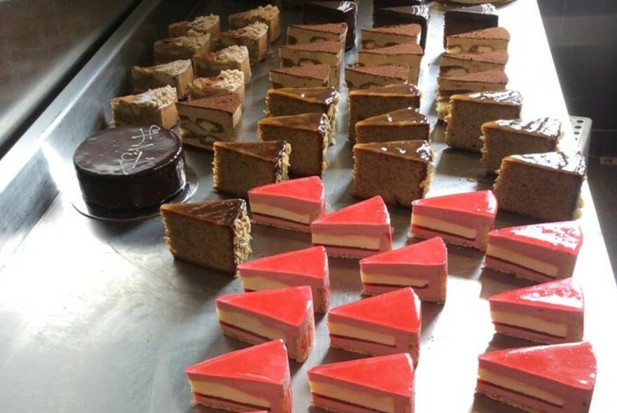 Display of chocolate and strawberry cake slices.