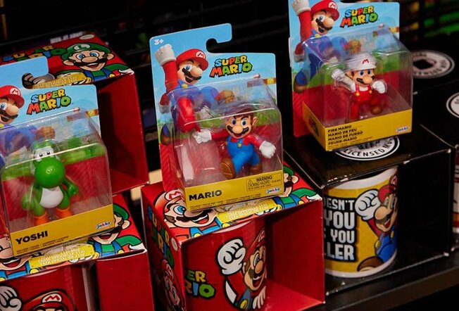 A collection of Super Mario figurines and mugs.