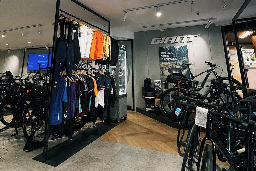 Interior of a bike shop with bikes and cycling apparel. 