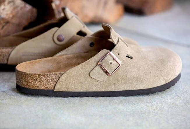 Birkenstock suede backless shoes with cork soles.